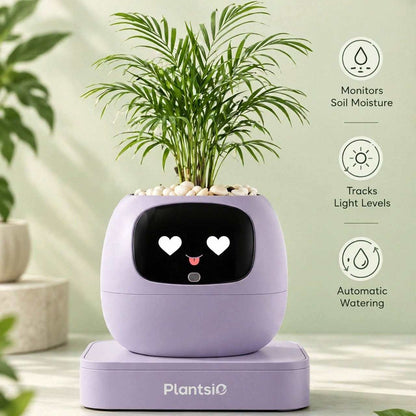 Smart Planter in lavender plastic with a black smiling face display, topped with white pebbles and a leafy palm plant