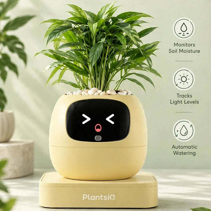 Smart Planter in a pale yellow rounded design with a black digital face, holding a leafy green plant