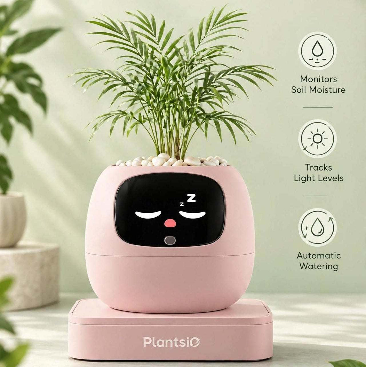 Smart Planter in pale pink with a rounded body, black sleepy face display, and leafy green plant on top